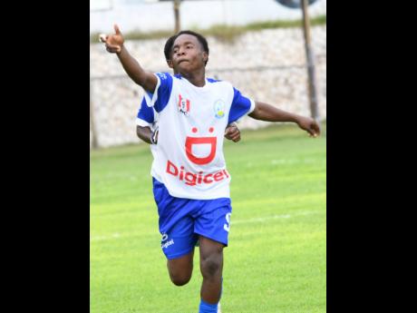 Hydel High School’s D’Sean Henry celebrates scoring one of two goals during an ISSA/Digicel Manning Cup game against Charlie Smith at the Anthony Spaulding Sports Complex yesterday.