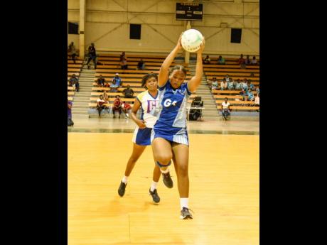 Kayla Wright (right) of St Catherine High collects a pass ahead of Christal Nicholson of Gaynstead High during last year’s ISSA urban senior netball final held at the National Indoor Sports Centre on December 8, 2022. St Catherine won 26-23.