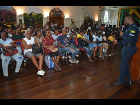 Eron Samuels, acting senior superintendent of police for St James, addresses vendors during a meeting last Friday in the parish. 