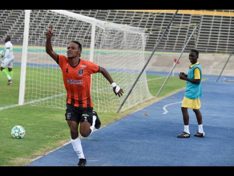 Howard Morris of Tivoli Gardens FC celebrates after scoring his team’s opening goal during yesterday’s Jamaica Premier League match against Waterhouse FC at the National Stadium. Tivoli won 3-0.