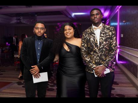 From left: Dominic Coburn, Ashanique Russell, and Asher Smith at the Night in Monte Carlo gala in Miami, Florida. 