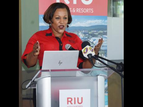 Niurka Garcia Linton, director of sales, RIU Jamaica, addresses the media during a press briefing at RIU Montego Bay in St James on Friday.