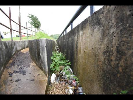 Drains at the Sligoville Sports Complex in St Catherine littered with garbage