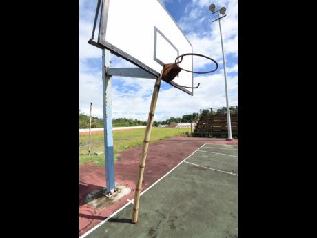 A bamboo stalk is used as reinforcement for the basketball hoop at one end of the courts.