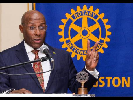 Minister of Industry, Investment and Commerce, Senator Aubyn Hill, delivers the keynote address at a general breakfast meeting of the Rotary Club of New Kingston at the Liguanea Club on October 27.