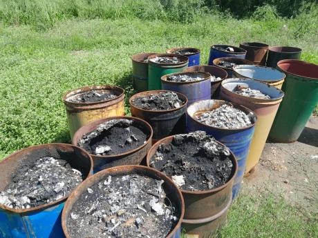 Photos by Corey Robinson
More than a dozen drums filled with ashes were seen, as well as burnt debris scattered around the apparently illegal medical waste facility on the outskirts of Hartlands in St Catherine