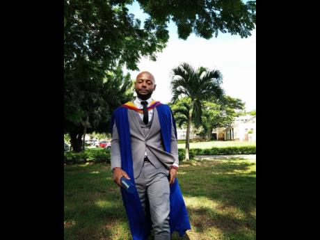 Sakima Mullings poses for a picture at the University of the West Indies, Mona, after graduating with a Master of Science in Sports Business Management recently. 