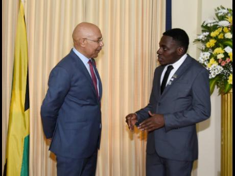 Governor General Sir Patrick Allen (left) in dialogue with Nile Anderson, Jamaica’s 2024 Rhodes Scholar, shortly after the announcement of his selection from a field of 11 finalists at King’s House on Thursday.