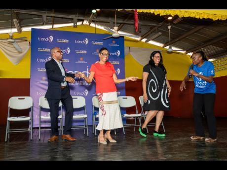 Master of ceremonies Jenny Jenny (right) invites key officials of the Ministry of Education & Youth (MOEY) to an impromptu TREND dance-off as the St Andrew Technical High School hosted the first in a series of school pop-ups. From left: CEO of e-Learning J