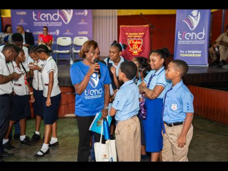Students from Windward Road Primary School were also present for TREND’s first School Pop-Up at St Andrew Technical High School on Tuesday. Master of Ceremonies Jenny Jenny explains the rules of one of the many exciting activities the students were able 