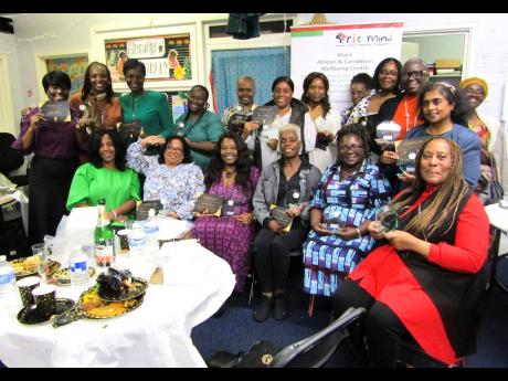 IRIE Mind awardees pose for a group photo after the ceremony in east London in which they were honoured for services to the community.