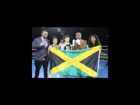 Donovan ‘Razor’ Ruddock (second right)  with (from left)  Mike Tyson’s son Amir, Karese Ruddock (daughter), Abel Mendoza and Kleopatra Ruddock (daughter) following his fight with James Toney  at the National Indoor Sports Centre on Saturday night.