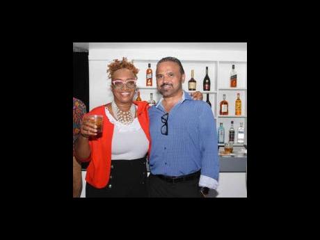 Carline Porter, client relations officer at JMMB Fairview branch, and Steven Serrao of SV Shoppers Mart were all smiles at the recent JMMB Bank Merchant Services mixer.