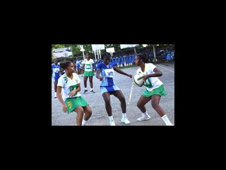 St Jago High School match skills against St Catherine High School in a previous round of the ISSA Urban Schoolgirl Netball competition at St Catherine High School on October 20. 