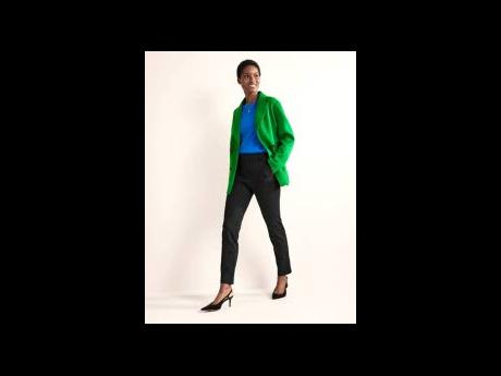 SAINT’s Martinican star, Aurelie Giraud, effortlessly showcases Boden’s cord blazer, highgate ponte trousers, and slingback heels.