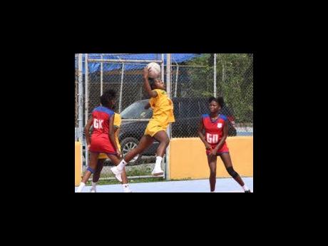 St Jago High School’s Poshanna-Lee Blake (centre) intercepts a pass between Camperdown High School’s Breneria Lawrence (left) and Cashante Samuels during Urban ISSA Schoolgirls’ netball action at the Leila Robinson Courts yesterday.  