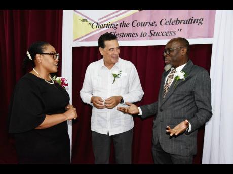 Stephen Shaw (right), manager of communications and customer services at the National Works Agency, commands the attention of Lavern Stewart, principal at Anchovy High School in St James, and Homer Davis, state minister in the Office of the Prime Minister 