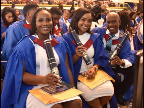 From left: Editha Brown, Alianne Barrow and David Johnson, graduands from the Faculty of the Built Environment, Surveying & Geographic Information Science Division, take part in day two of the graduation at the University of Technology. 