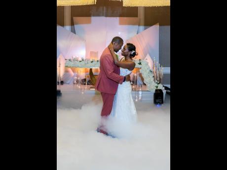 Swept away in the rhythm of their love story, Jermaine and Kayla share their first dance as husband and wife.
