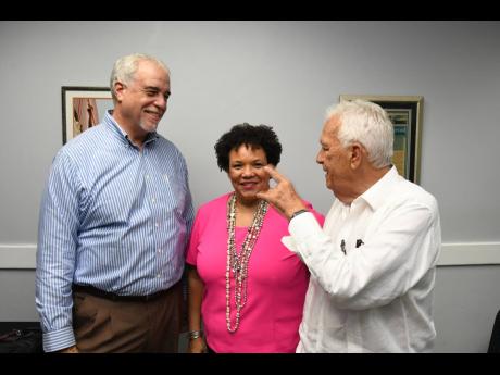 Newly-elected president of the Shipping Association of Jamaica Corah Ann Robertson Sylvester shares a light moment with past presidents, Kim Clarke (left) and Charles Johnston following the associaiton’s annual general meeting last Friday.
