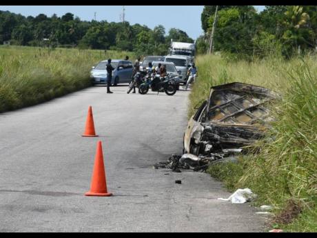 The scene of the crash that claimed the life of two students along the Petersfield main road in Westmoreland on Tuesday morning.