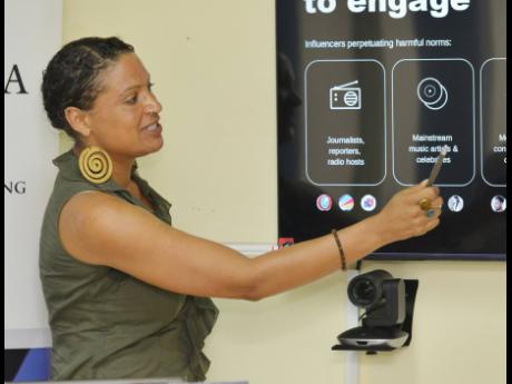 Helen Atkins, monitoring, evaluation, accountability and learning (MEAL) officer at WE-Talk, making a presentation during the WE-Talk seminar for the reduction of gender-based violence at the Government of Canada field support service project office on Rut