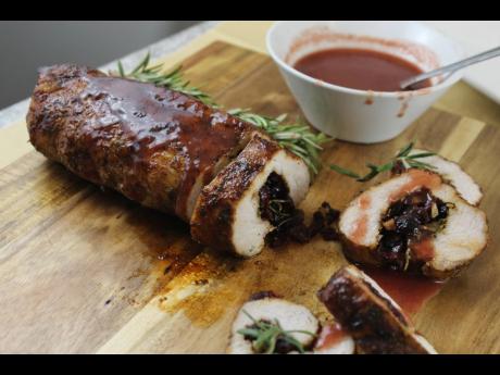 A closer look at Chef Noel Cunningham’s culinary masterpiece: spiced cranberry and rosemary stuffed pork tenderloin, served with a cranberry Appleton reserved sauce.