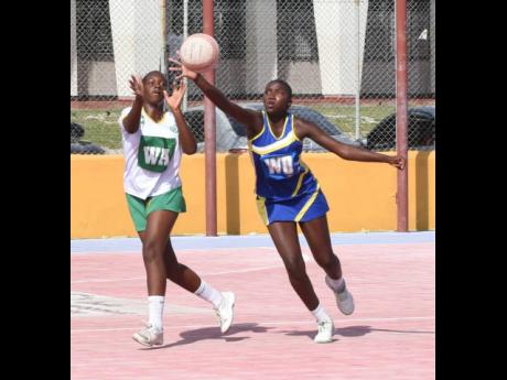 Gaynstead High School’s Akeelah Mrtin (right) intercepts a ball ahead of St Jago High School’s Shanna-Kay Harris during a top-of-the-table Group 1 ISSA Urban Schoolgirl netball game at the Leila Robinson Courts yesterday.