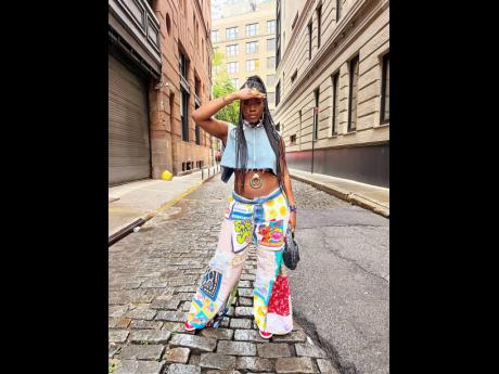 Stylist and fashionista Shea Dixon styled patchwork jeans with a denim Zara cropped top, accentuated by a medallion chain, and complemented by Teyana Taylor Jordan 1s.