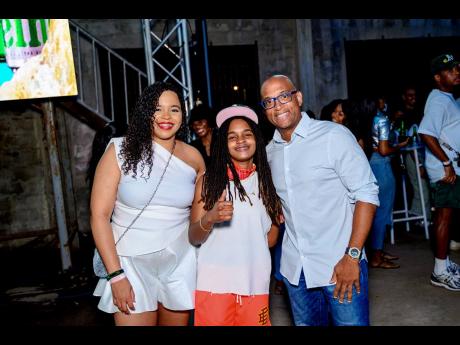 Pulling up to the party are Koffee (centre), Amoye Phillpotts-Brown, Heineken brand manager (left), and Sean Wallace, Red Stripe head of commercial.