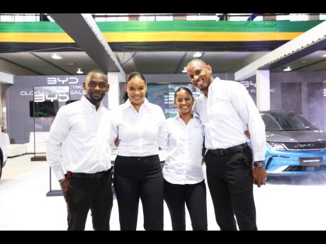 The BYD Kingston sales team is all smiles at the BYD VIP Launch held at the National Arena ahead of the ATL Automotive Revolution Auto Show. From left to right are Courtney Smith, BYD Kingston sales manager, Alyssa Jones and Roschelle Mills, sales executiv