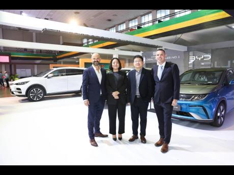 Stephen Hector, group marketing director, ATL Group, Neva Zhang, country manager, and Howard Xiang, after-sales manager, Central and Latin America, BYD; and Mark Dommisse, managing director, ATL Automotive Group are all smiles at the BYD Brand Stand at the