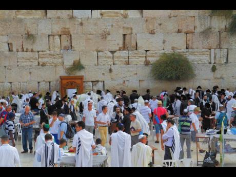 Religious Jews going to pray at the Western Wall of the Temple