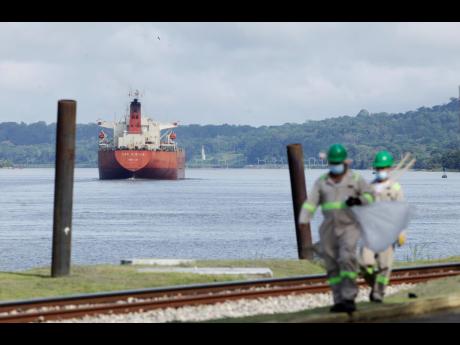 A cargo ship navigates through Panama Canal waters in Gamboa, Panama, in June 2020. 