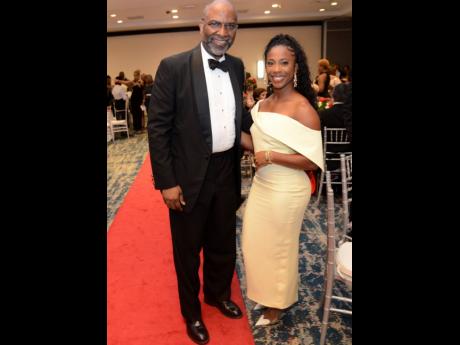 Earl Jarrett, chairman of the Campus Council of The University of the West Indies, pairs up with Dr Shelly-Ann Fraser-Pryce in this quick photo op.