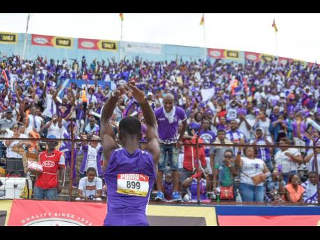 Akeem Weir of Kingston College celebrates towards the KC supporters after winning the Class Three boys’ 400m final at the ISSA/GraceKennedy Boys and Girls’ Athletics Championships at the National Stadium in March 2019.