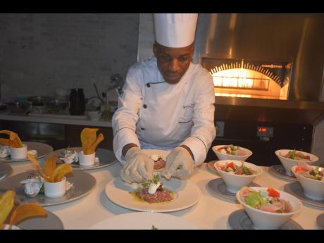 Executive Chef Tyron Jackson serves up culinary delights in the open kitchen.