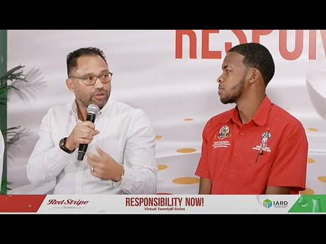 Raynor Honeyghan,cultural and entertainment affairs chairperson, of The University of the West Indies, Mona, listens as Dr Shane Alexis, general practitioner and past president of the Medical Association of Jamaica, makes a point at the Red Stripe ‘Respo