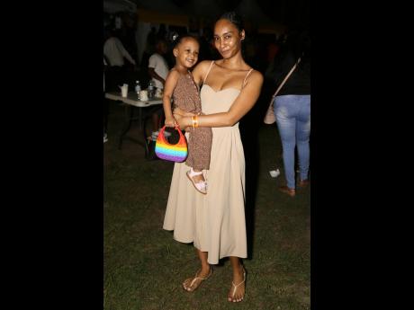 Above: Sharing this beautiful mother-daughter moment while rocking earth-tone styles are Kasoon Dawkins and Gaia-Khalessi (left).