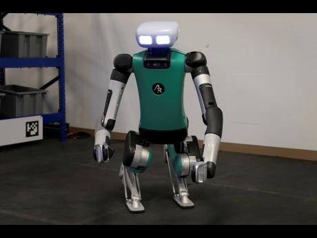 Agility Robotics’ robot Digit performs gestures at the company’s office in Pittsburgh.