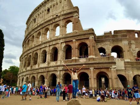 World traveller alert! DaCosta shows off her killer smile outside the Colosseum in Rome, Italy.