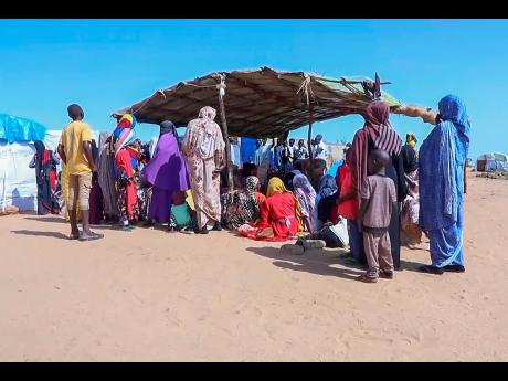 Sudanese refugees gather outside a field hospital in Acre, Chad.