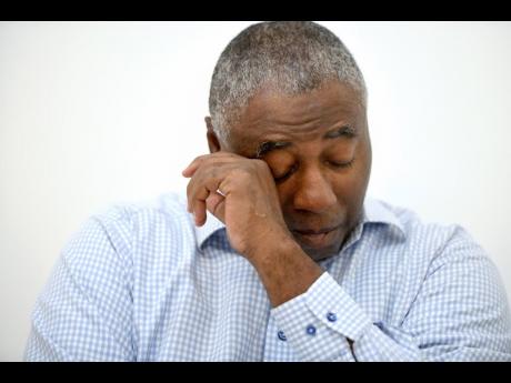 Charles Richardson, of Baltimore, wipes his eye while discussing his alleged abuse decades ago by a Catholic priest, in Baltimore.