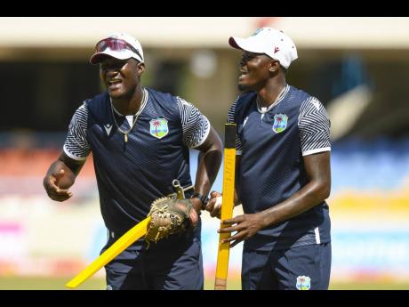 CWI Photo 
West Indies coach Daren Sammy (left) and his vice-captain, Alzarri Joseph, during a training session in Antigua recently. 