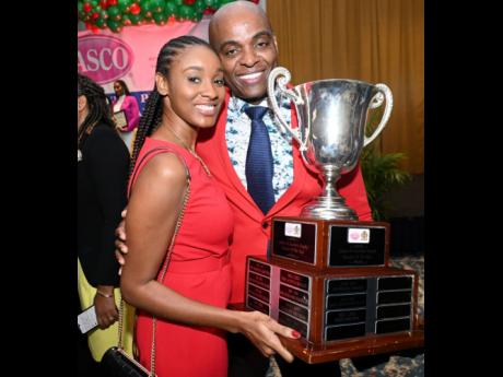 Franklin Burrell of St Andrew High School for Girls celebrates with his wife, Kaven, after being named the LASCO/Ministry of Education/Jamaica Teaching Council 2023 Teacher of the Year during a ceremony at The Jamaica Pegasus hotel in New Kingston on Tuesd