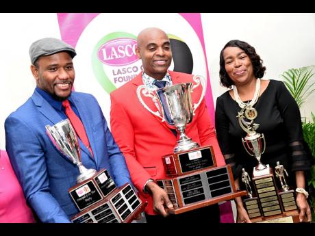 From left: Principal of the Year Rayon Simpson, of Belmont Academy; Teacher of the Year Franklin Burrell, of St Andrew High School for Girls; and TVET Teacher of the Year Ilene Cohall-Bailey, of The Manning’s School, pose with their trophies at the LASCO