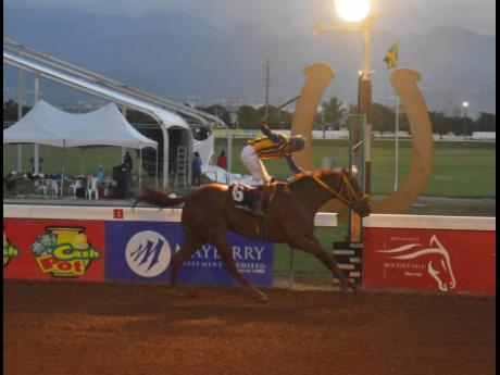 SENSATIONAL MOVE, ridden by Rudolph Paige, wins despite long odds of 62-1, capturing the MONEY TIME Trophy, a restricted allowance stakes for horses three years old and upwards at Caymanas Park on Saturday, November 11.