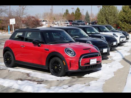 AP 
Unsold 2024 Cooper SE electric hardtops sit outside a Mini dealership on Thursday, November 30, in Loveland, Colorado. EV inventory is building on dealer lots, and many EV models are taking longer to sell than their gas-fuelled counterparts.
