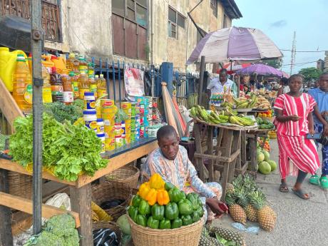 AP 
People shop at a market in Lagos, Nigeria, on Wednesday, November 29, 2023. Nigeria’s leader on Wednesday presented a $34-billion spending plan for 2024 to federal lawmakers, with a key focus on stabilising Africa’s largest but ailing economy.