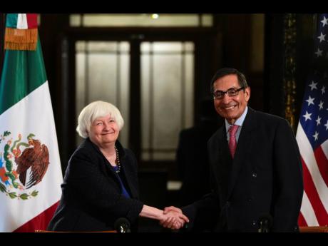 AP 
United States Treasury Secretary Janet Yellen and the Mexican Secretary of Finance Rogelio Ramirez de la O shake hands after a news conference at the National Palace in Mexico City yesterday.
